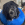 A black dog wearing a blue KONG neck ring.